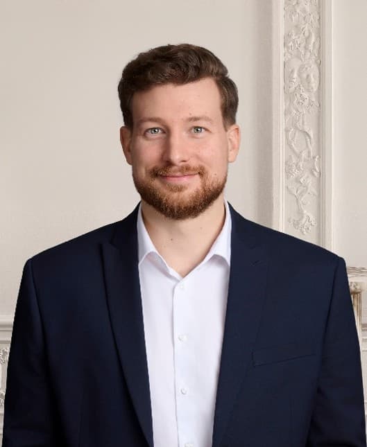 Porträtfoto von Dr. Christopher Reh, Managing Director